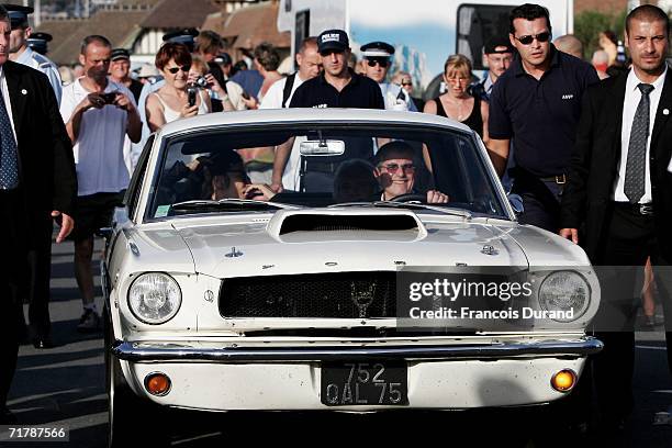 Director Claude Lelouch arrives driving a Mustang with actress Anouk Aimee at the 32nd Deauville Festival Of American Film as the city of Deauville...