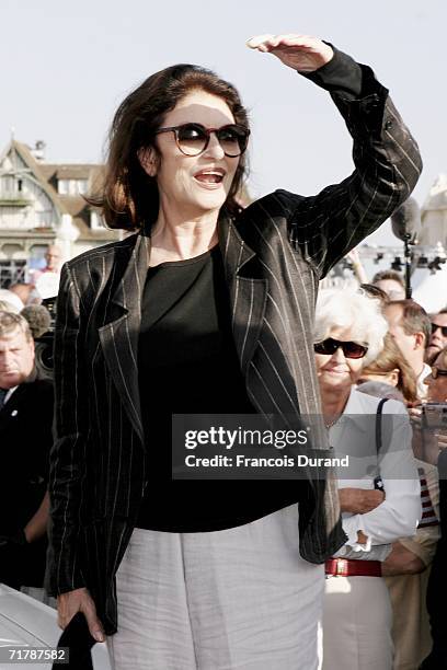 Actress Anouk Aimee waves to the fans at the 32nd Deauville Festival Of American Film as the city of Deauville pays homage to Lelouch on September 5,...