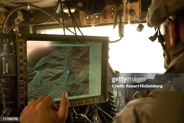 Army soldiers from the 10th Mountain Division move up a dirt road from Naray, Kunar to a Forward Operating Base in Kamdesh, Nuristan August 24 in...