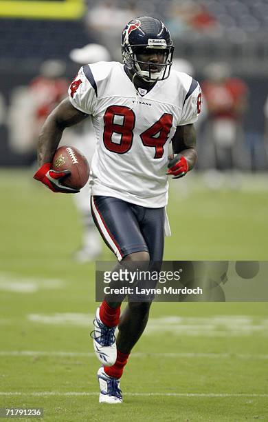 Eric Moulds of the Houston Texans carries the ball before a preseason game against Tampa Bay Buccaneers on August 31, 2006 at Reliant Stadium in...