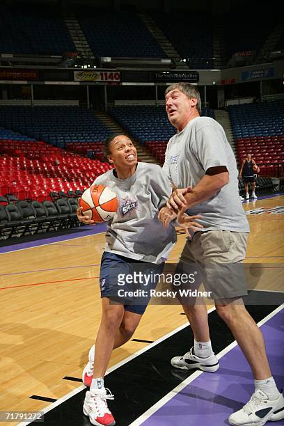 Detroit Shock guard, Kendra Holland-Corn, tries to get around head coach, Bill Laimbeer, during practice on September 5, 2006 at ARCO Arena in...