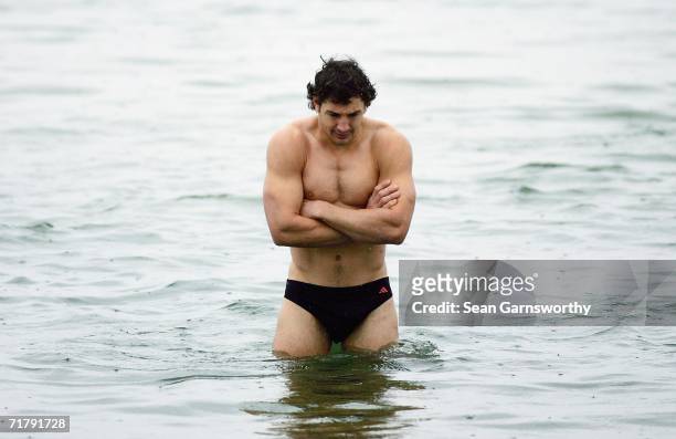 Billy Slater of the Storm feels the cold as he stands in the water during a Melbourne Storm recovery session at St Kilda Beach on September 6, 2006...
