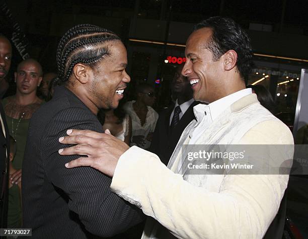 Actor/singer Alvin "Xzibit" Joiner and actor Dwayne "The Rock" Johnson arrive at the premiere of Columbia Picture's "Gridiron Gang" at the Chinese...