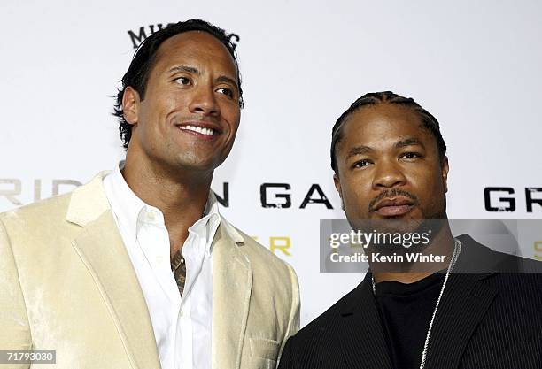 Actor Dwayne "The Rock" Johnson and singer/actor Alvin "Xzibit" Joiner arrive at the premiere of Columbia Picture's "Gridiron Gang" at the Chinese...