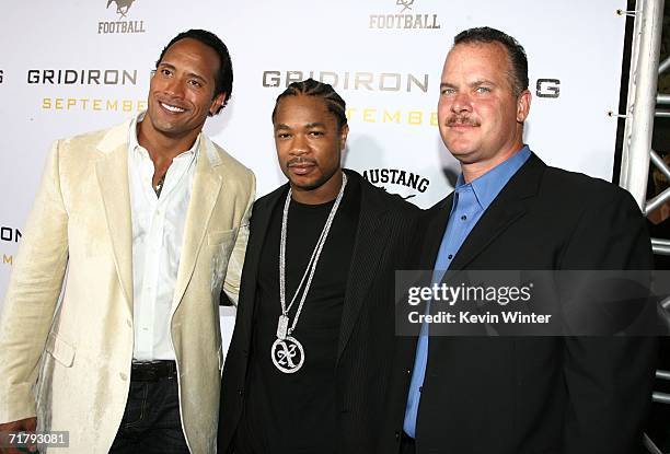 Actor Dwayne "The Rock" Johnson , singer/actor Alvin "Xzibit" Joiner and Sean Porter arrive at the premiere of Columbia Picture's "Gridiron Gang" at...