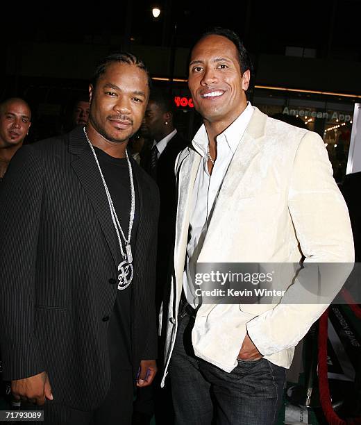 Actor/singer Alvin "Xzibit" Joiner and actor Dwayne "The Rock" Johnson arrive at the premiere of Columbia Picture's "Gridiron Gang" at the Chinese...
