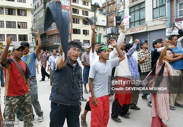 Nepalese political activists of the Newar ethnic community shout anti-King slogans during a protest held on the sidelines of the Indra Jatra Festival...