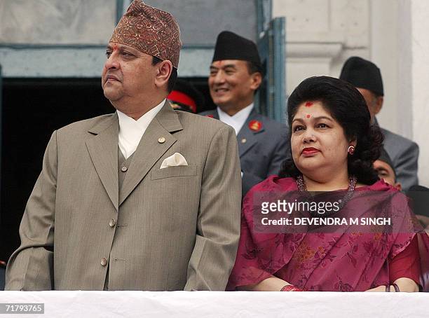 Nepal's King Gyanendra and Queen Komal watch a chariot procession carrying Kumari, a pre-pubescent girl revered by many in Nepal as a living goddess,...