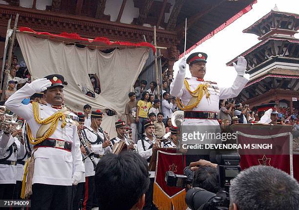 Nepalese Gurkha soldiers of the Nepalese Army play the pro-royal national anthem during the Indra Jatra festival in Kathmandu 06 September 2006. King...