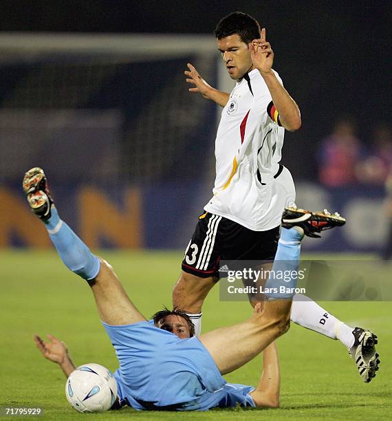 Michael Ballack of Germany in action with Manuel Marina of San Marino during the UEFA EURO 2008 qualifier between San Marino and Germany at the...