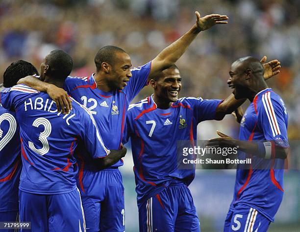 Thierry Henry of France celebrates with team-mate William Gallas after the first goal during the Euro2008 Qualifing match between France and Italy at...
