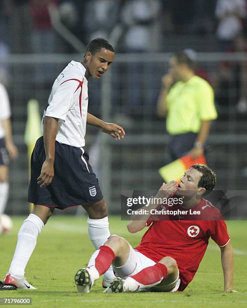 Theo Walcott of England looks down at Stefan Lichtsteiner of Switzerland during the UEFA Under European 21s Championship Qualifing Group 8 match...