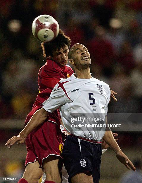 English defender Wes Brown vies for the ball with Macedonia's forward Goran Maznov during their Euro 2008 Championship qualifying match in Skopje, 06...