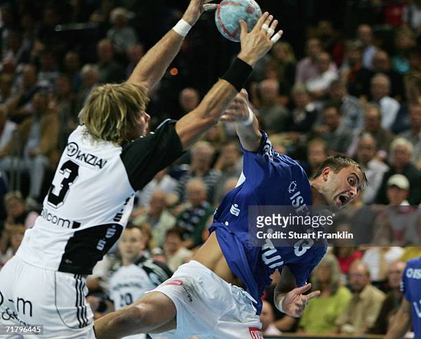 Pelle Linders of Kiel tries to block a shot from Momir Ilic of Gummersbach during the Bundesliga game between THW Kiel and Gummersbach at The...