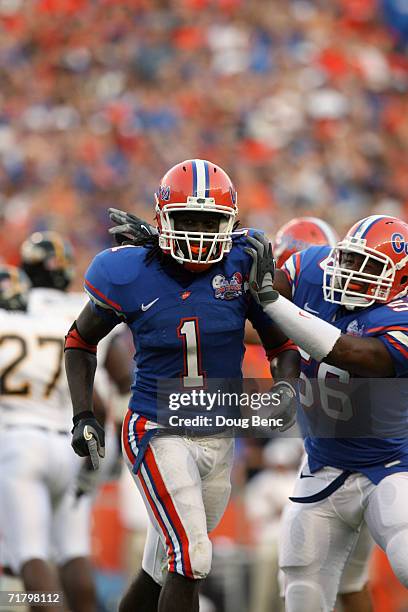 Safety Reggie Nelson and linebacker Darryon Robinson of the University of Florida Gators celebrate a play during the game against the Southern Miss...