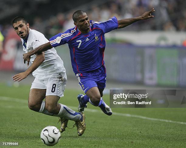 Florent Malouda of France is brought down byGennaro Gattuso of Italy during the Group B, Euro 2008 qualifying match between France and Italy at the...