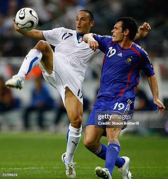 David Di Michele of Italy is challenged by Willly Sagnol of France during the Euro2008 Qualifing match between France and Italy at the Stade de...