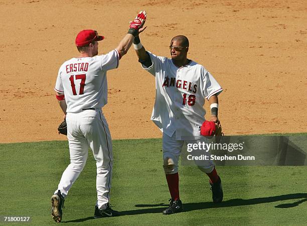 First baseman Darin Erstad and shortstop Orlando Cabrera of the Los Angeles Angels of Anaheim celebrate after the game against the Baltimore Orioles...