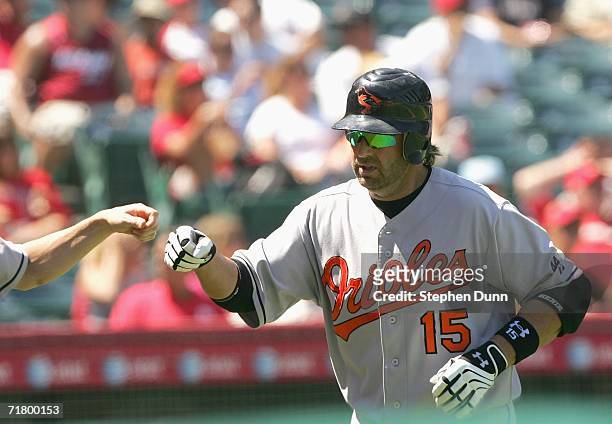 Kevin Millar of the Baltimore Orioles is greeted after hitting a home run in the fourth inning against the Los Angeles Angels of Anaheim on September...