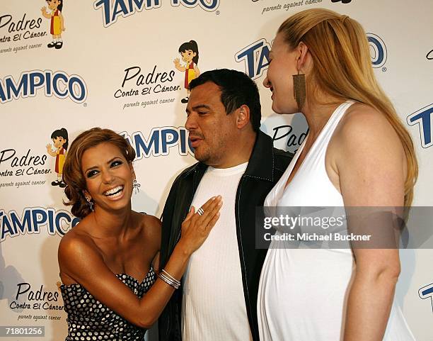 Actress Eva Longoria, comedian Carlos Mencia and wife Amy Mencia arrive at the El Sueno De Esperanza Gala at Wisteria Lane on the Universal Studios...