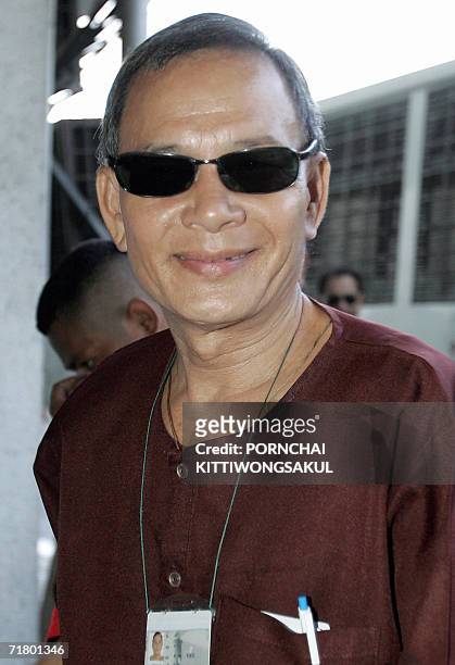 Vietnamese pilot and US citizen who hijacked a plane from Thailand in November 2000, Ly Tong smiles as he arrives at the Criminal Court in Bangkok,...