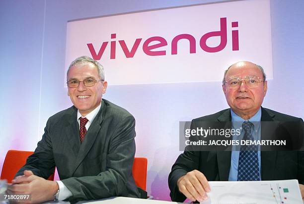 Vivendi's board director Jean-Bernard Levy and Financial director Jacques Espinasse attend a press conference to announce the company's first-half...