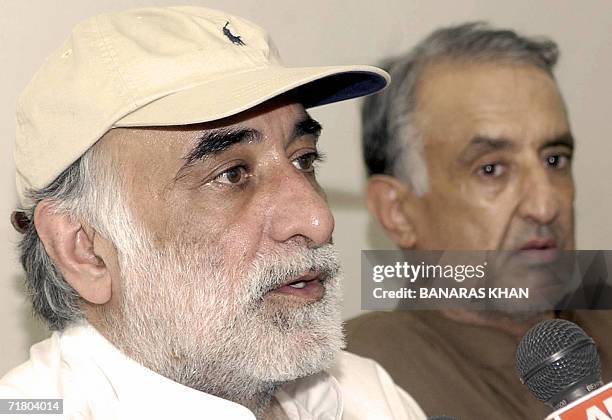 Jamil Bugti , son of slain rebel tribal chief Nawab Akbar Bugti, speaks to media representatives as his brother Talal Bugti looks on during a press...