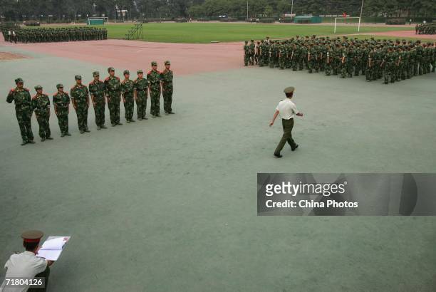 Military officer directs students to rank during a military training at the Tsinghua University on September 7, 2006 in Beijing, China. China...