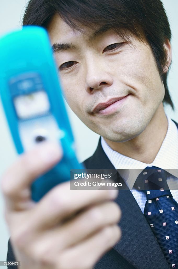 Close-up of a businessman holding a mobile phone