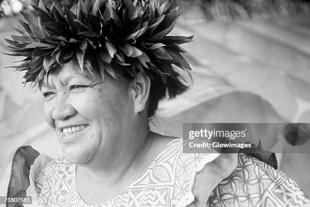 close-up of a mature woman wearing a laurel wreath, hawaii, usa - south pacific islands culture stock pictures, royalty-free photos & images