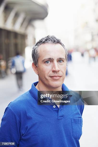 portrait of a mature man on the street - polo shirt stock pictures, royalty-free photos & images