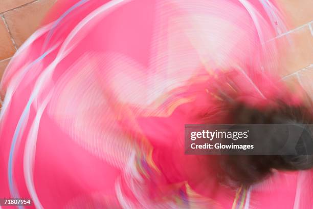 high angle view of a woman dancing - flamenco danza tradizionale foto e immagini stock