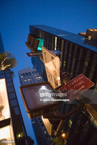 low angle view of a walk signal at night - pedestrian crosswalk stock pictures, royalty-free photos & images