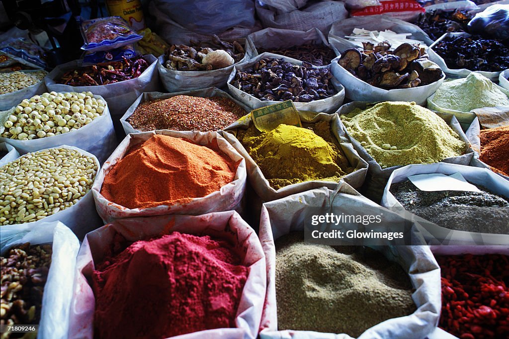 Close-up of spices in sacks, China
