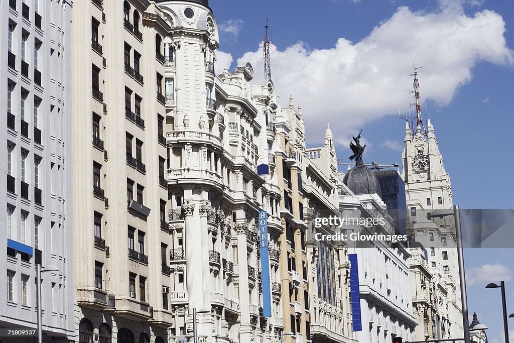 Low angle view of buildings in a city, Madrid, Spain