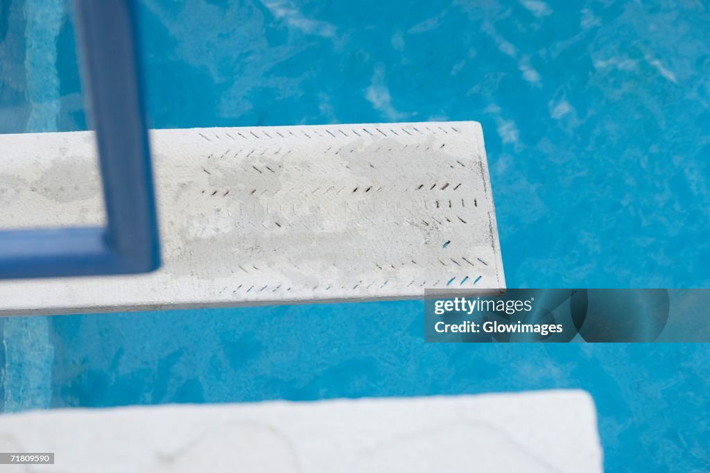 Diving board near a swimming pool