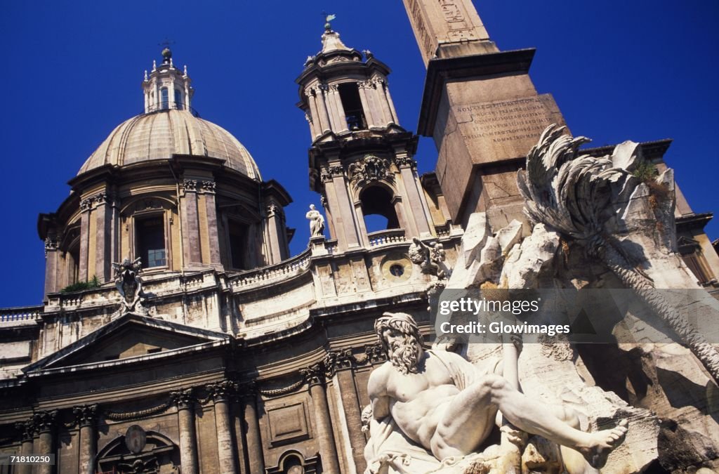 Statue in front of a building, Rome, Italy
