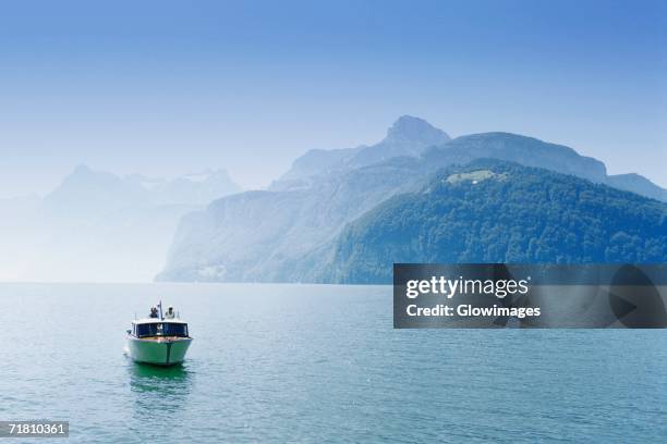 boat in a lake, lake lucerne, switzerland - lake lucerne stock pictures, royalty-free photos & images