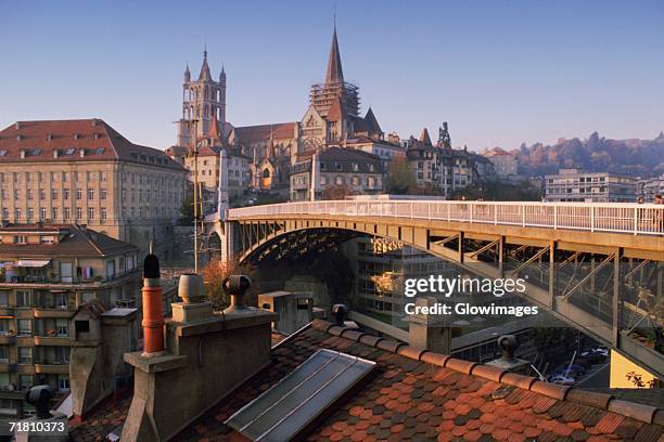 arch bridge in a city, lausanne, vaud, switzerland - lausanne stock-fotos und bilder
