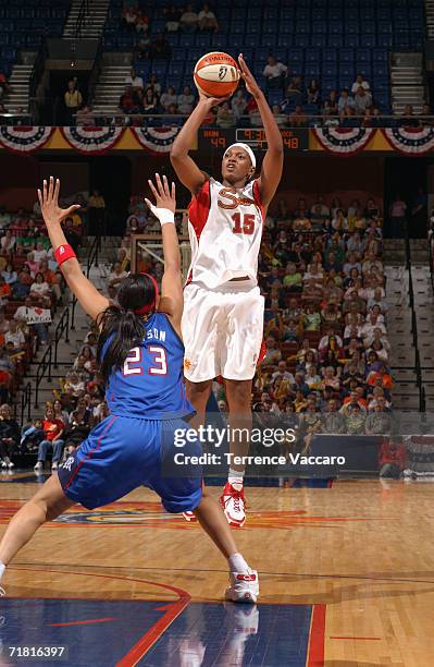 Asjha Jones of the Connecticut Sun shoots a jump shot over Plenette Pierson of the Detroit Shock during a game at Mohegan Sun Arena on June 30, 2006...