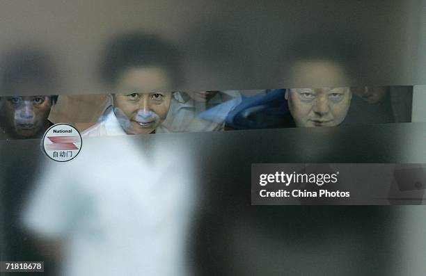 Doctor accompanies parents to wait outside the operating room, as their child undergoes a laser eye surgery, which utilizes computer-controlled...