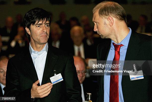 Joachim Loew, head coach of Germany's national football team and U21's Coach Dieter Eilts poses during the DFB Extraordinary Session at the Congress...