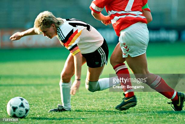 Silvia Neid of Germany battle for the ball during the women's European Championship qualifying match between Germany and Denmark at the Stadium...
