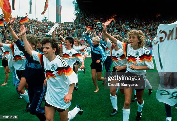 The German team celebrate after winning the women's European Championship final match between Norway and Germany at the Stadium Bremer Bruecke on...