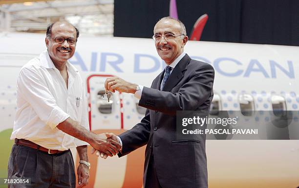 French president of ATR Filippo Bagnato hands over the key of the 700th ATR plane to the Indian president of the low-cost Air Deccan company, Captain...