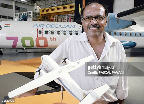 Indian president of the low-cost Air Deccan company, Captain Gopinath poses in front of a ATR 72-500 model, 08 September 2006 at the ATR factory in...