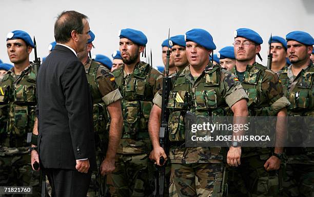 Spanish Defense Minister Jose Antonio Alonso inspects troops prior to their departure from the Spanish naval base at Rota in southern Spain to join...