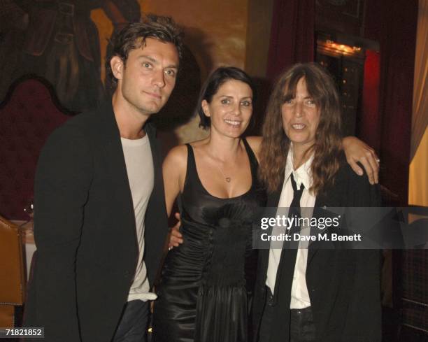 Actor Jude Law, Sadie Frost and musician Patti Smith attend the Robert Mapplethorpe: 'Still Moving and Lady' exhibition after party at the Dorchester...