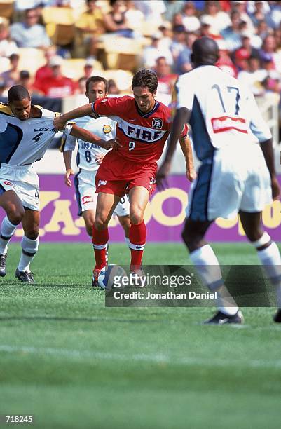 Ante Razov of the Chicago Fire controls the ball as he grabs Robin Fraser of the Los Angeles Galaxy at Soldier Field in Chicago, Illinois. The Fire...
