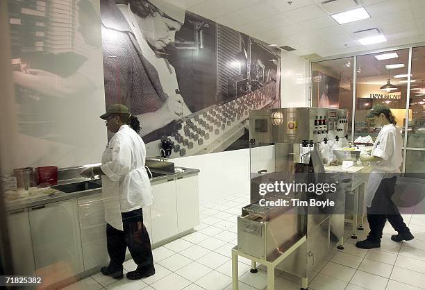 Workers prepare sweets in the Frango Mint sample kitchen in the current Marshall Field's flagship State Street store September 8, 2006 in Chicago,...